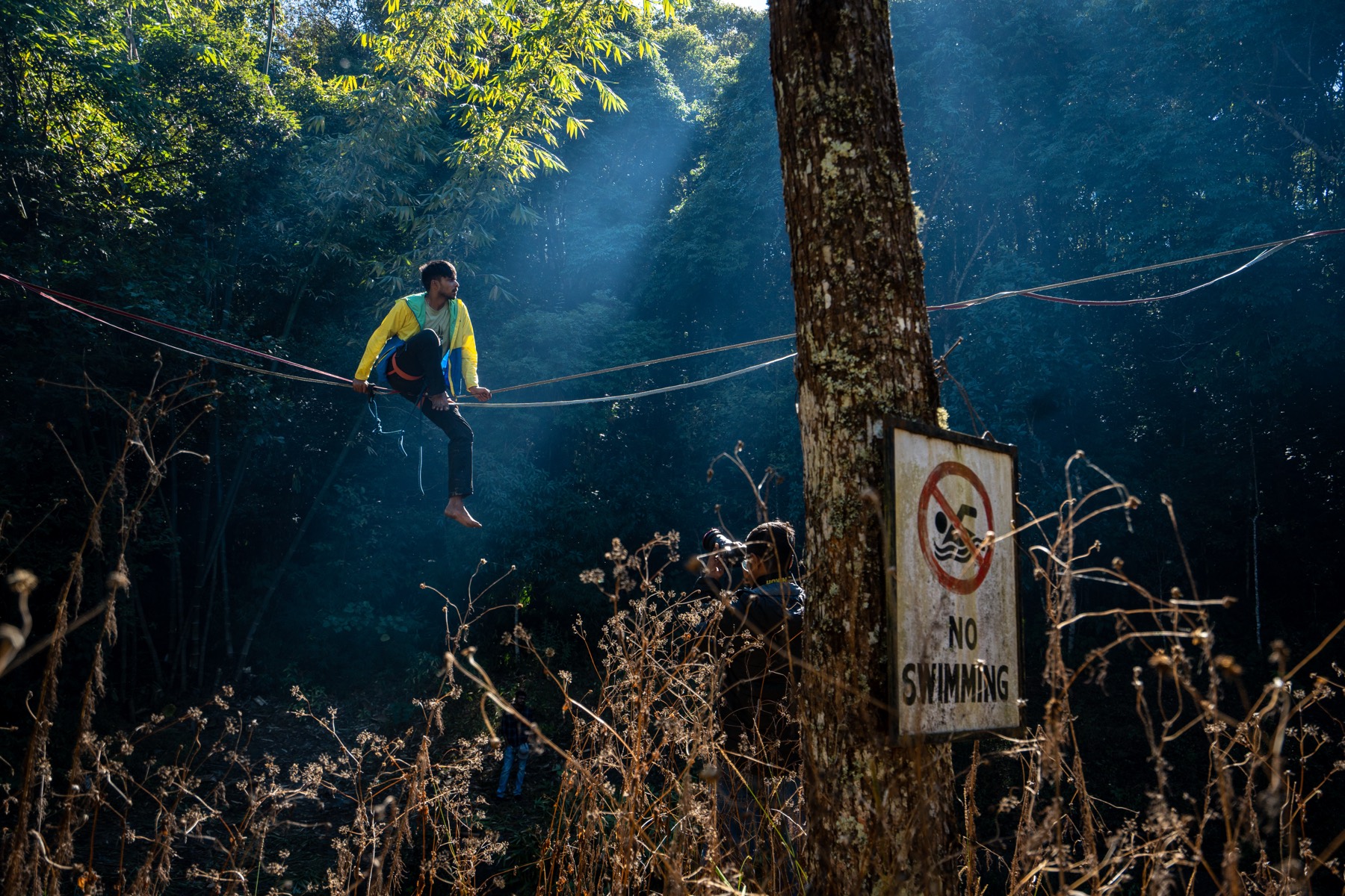 Slacklining between forest trees