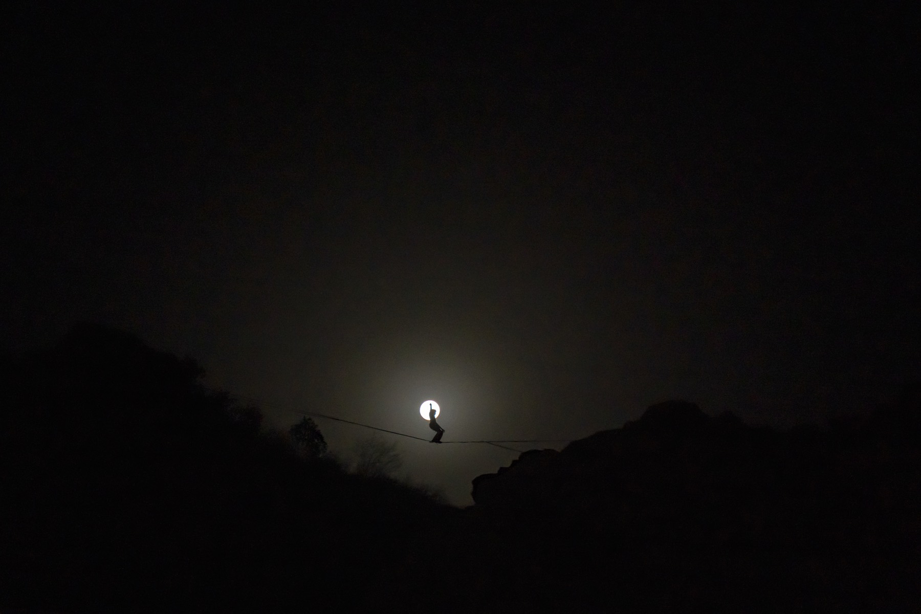 Highline against the moon