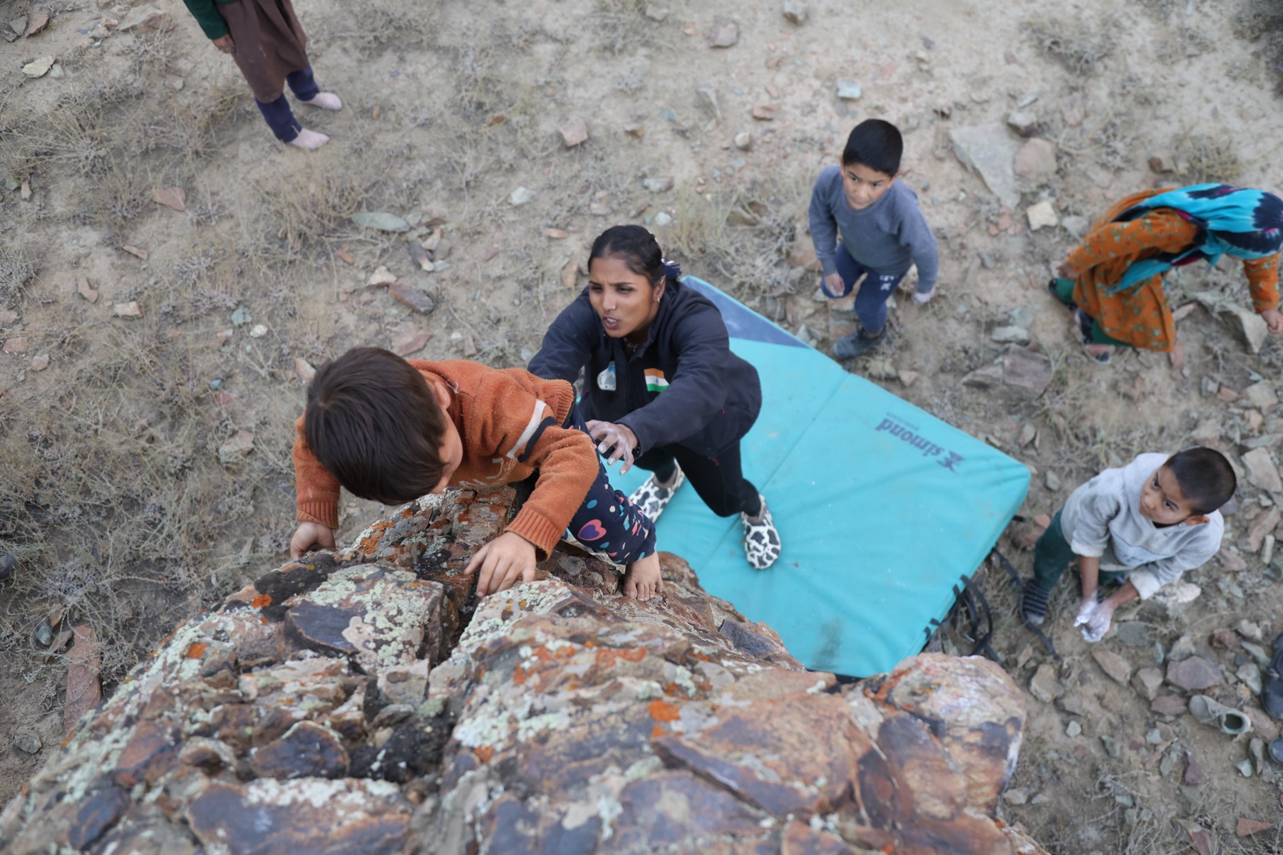A young climber on her first boulder